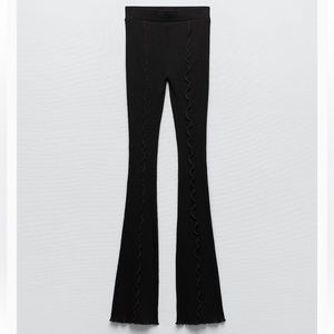 Black flared pants brown detailing